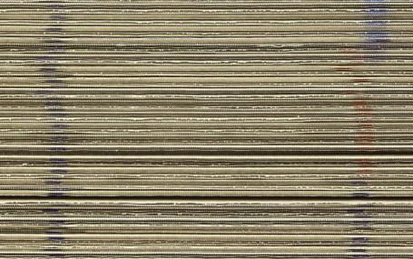 Stacked sheets of corrugated cardboard.
